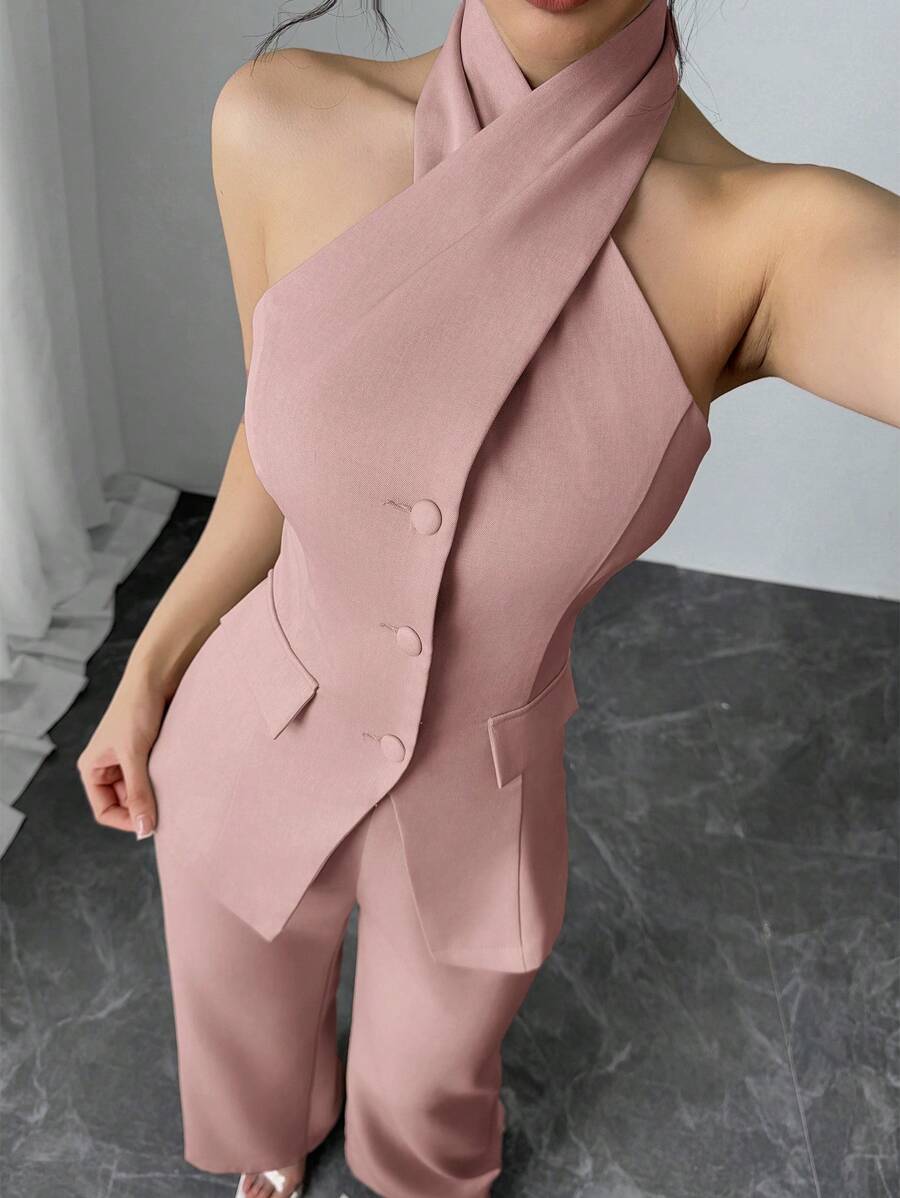 Turn heads this season with our effortless two-piece set that perfectly blends edge and elegance. The backless halter top features a daring cutout design that's Instagram-worthy, while the flowing long pants keep things polished and put-together. Whether you're heading to brunch, the office, or a night out, this set delivers that coveted "I woke up like this" vibe without the effort. Mix, match, or wear together—versatility never looked so good.