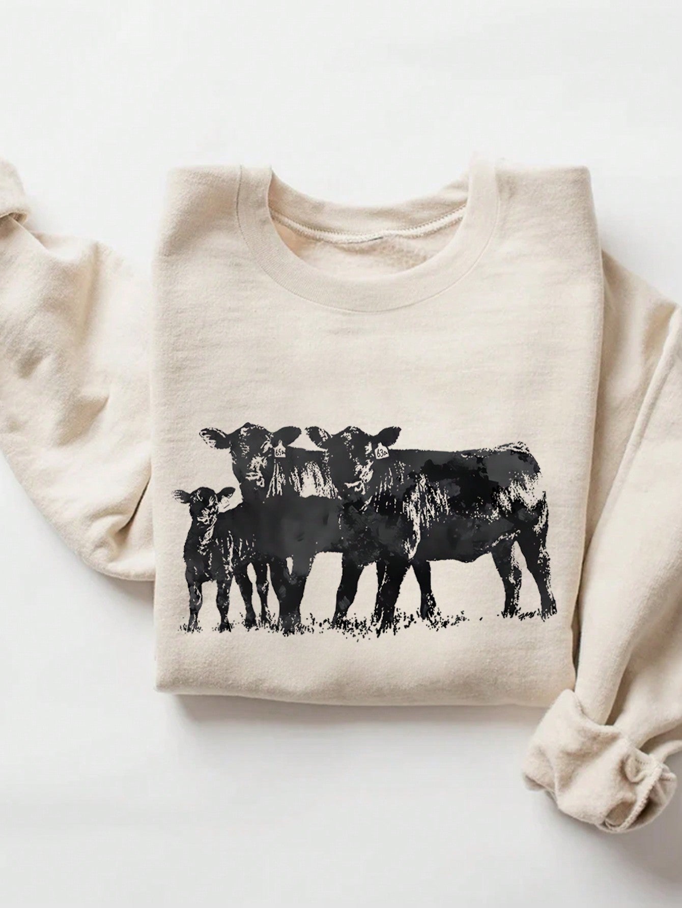 Stay chic and cozy with our Trendy Black Cow Print Women's Sweatshirt. Featuring a fun cow print pattern and thermal lining, this sweatshirt will keep you warm and stylish. The round neck adds a touch of versatility to complete your look. Perfect for any trendy cow lover!