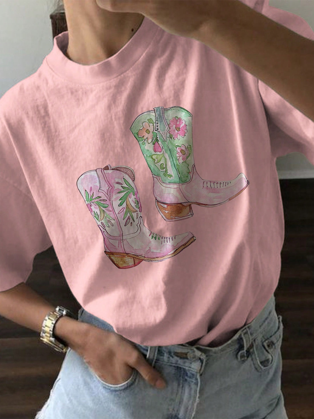 Introducing our Trendy Boot Print Summer Tee for Women. Stay stylish and comfortable this summer with our high-quality t-shirt featuring a trendy boot print design. Made with soft and breathable fabric that will keep you cool all day long. Perfect for casual outings and everyday wear.