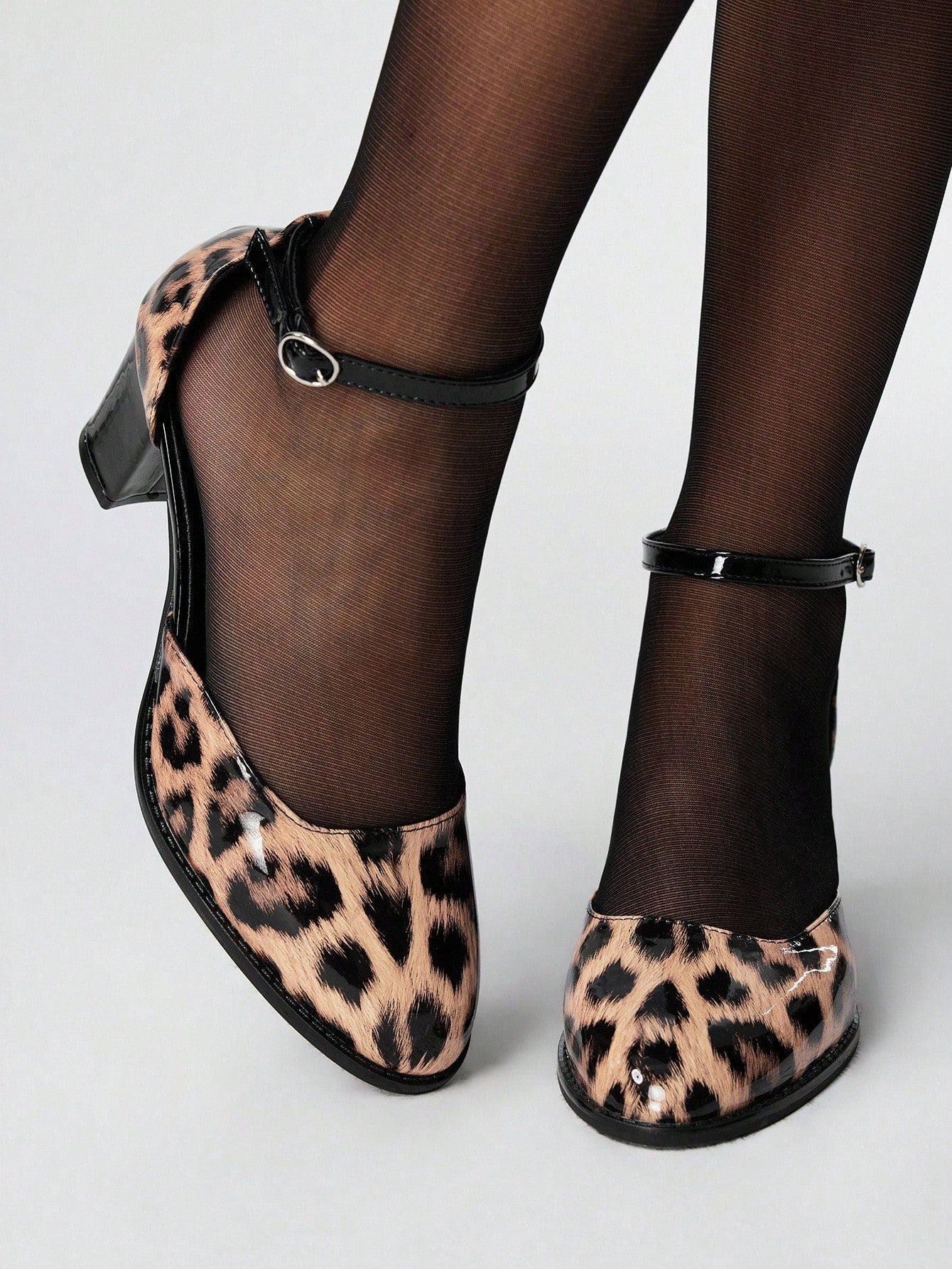 Step out with attitude in these Trendy Brown Leopard Print Chunky Heel Pumps. Designed for a bold grunge punk vibe, their eye-catching print and sturdy chunky heel make every stride a statement. Perfect for adding a playful edge to your look while keeping comfort in check. Unleash your wild side in style!