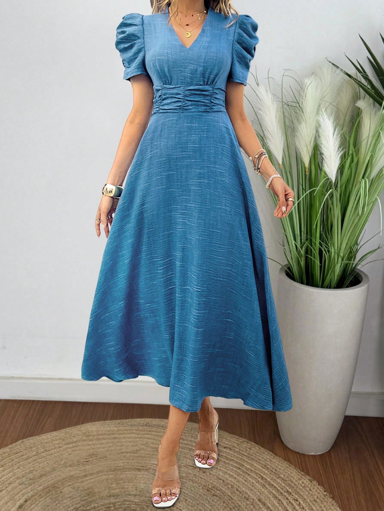 Make a statement with this stylish and elegant dress! Featuring trendy bubble sleeves and a pleated waistband, this dress is perfect for any fashion-forward woman. Upgrade your wardrobe with this must-have piece!