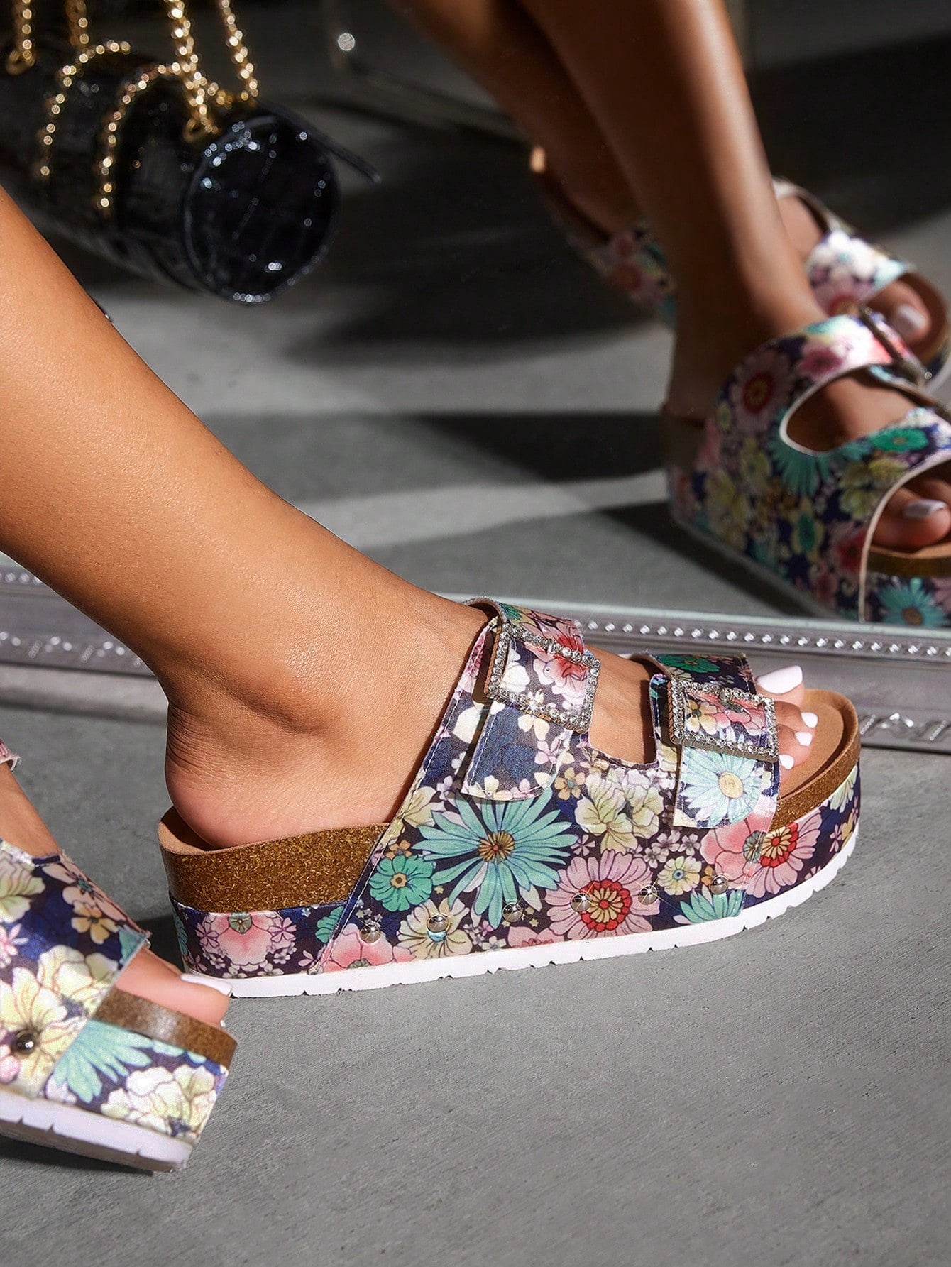 These trendy wedge sandals feature colorful floral straps, offering chic comfort for any occasion. The unique design adds a touch of style to any outfit, while the wedge provides added support and comfort. Perfect for everyday wear or special events. Elevate your wardrobe with these must-have sandals.