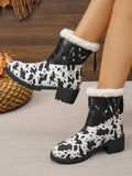 These boots are the perfect combination of style and warmth. Featuring a trendy cow print and a convenient zipper, these tall boots also have a thermal lining to keep your feet cozy. Say goodbye to boring winter footwear and hello to comfort and fashion in these boots!