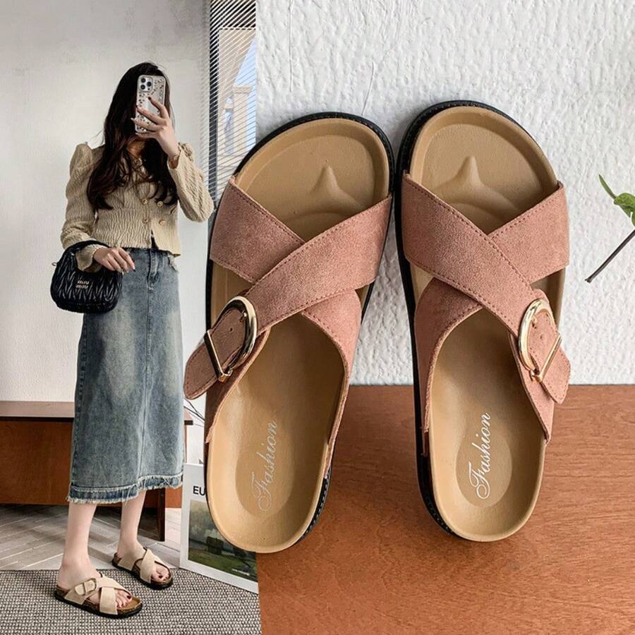 4 media show dusty pink and beige suede-look crisscross slide sandals with gold side buckle, tan molded footbed, stitched welt look, black chunky outsole. image 1