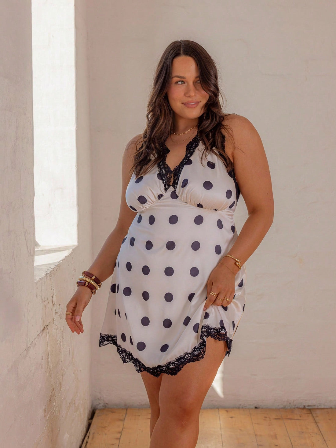 Turn heads at every summer beach party and graduation with this Trendy Curve Lace Trim Polka Dot Satin Mini Dress. Its silky satin fabric and playful polka dots create a chic, fun vibe, while the delicate lace trim adds a flirty touch. The mini length keeps it breezy and perfect for warm days and nights. Dress up your sunny celebrations with this stylish and comfortable piece that’s made to party as hard as you do!