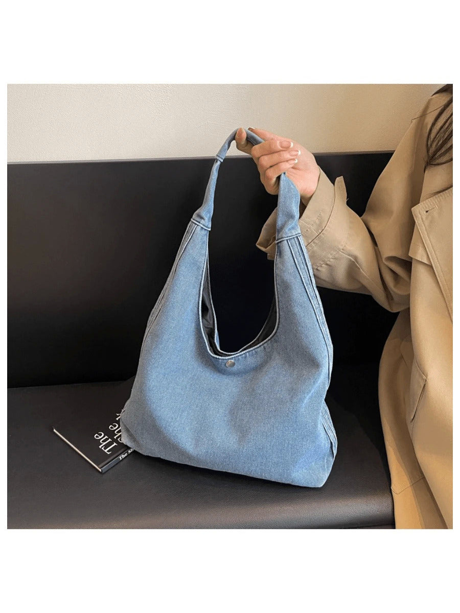 Meet your new go-to sidekick for every casual outing—the Trendy Denim Crescent Shoulder Bag! With its slouchy hobo shape and cool denim vibe, this purse brings effortless style to your college days and weekend adventures. Spacious enough to hold all your essentials, it’s the perfect mix of playful charm and practical comfort. Sling it over your shoulder and step out with confidence and laid-back flair!