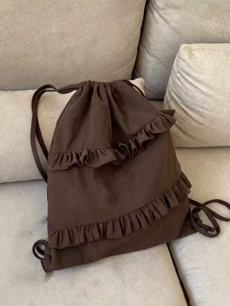 Stylish and versatile drawstring backpack designed for the modern woman. Features multiple pockets for organized storage, comfortable padded straps, and a spacious main compartment perfect for books, laptops, and travel essentials. The durable fabric withstands daily wear while the sleek design complements any outfit. Ideal for school, commuting, weekend getaways, or everyday adventures. Lightweight yet functional, this backpack combines practicality with contemporary style.