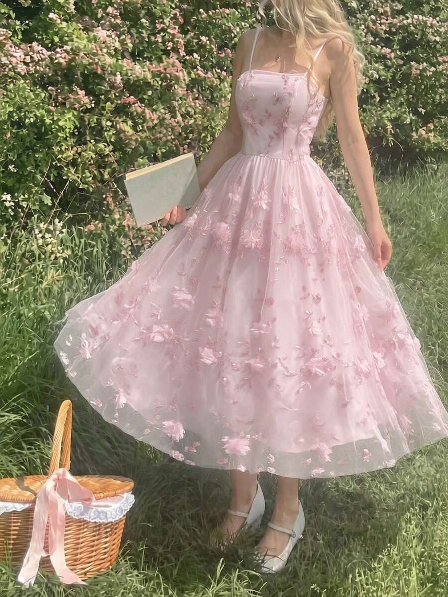 Elevate your warm-weather wardrobe with this sophisticated floral spaghetti strap dress. Crafted in soft pastel tones, the delicate botanical print creates an effortlessly chic aesthetic perfect for brunch, garden parties, or casual outings. The lightweight fabric drapes beautifully while the adjustable spaghetti straps ensure a comfortable, personalized fit. This versatile piece transitions seamlessly from day to evening—pair with sneakers for relaxed elegance or dress up with heels and jewelry. An essenti