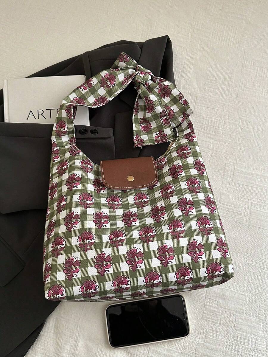 Add a splash of fun to your daily look with this trendy green floral plaid crossbody bag. Perfectly sized for your essentials, it blends vibrant floral patterns with classic plaid for a playful twist. Lightweight and easy to carry, it’s your go-to accessory for adding a pop of color and charm to any outfit, anytime.