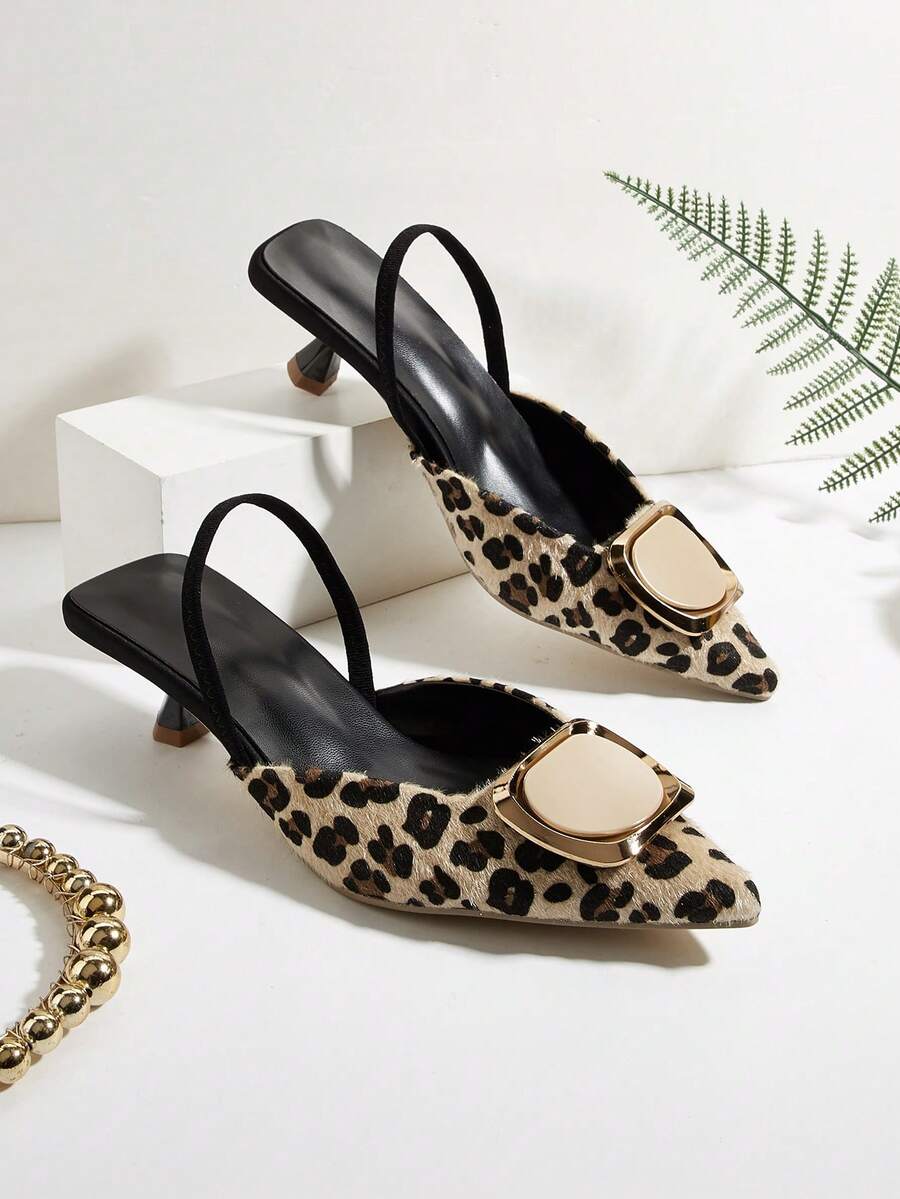 Elevate your party look with these elegant apricot slingback pumps featuring a charming pom pom detail and decorative metal buckle accent. Crafted from soft PU leather with a textured pattern, these kitten heels offer the perfect balance of style and wearability. The pointed toe and slip-on design provide effortless sophistication, while the low heel ensures all-day comfort. True to size and ideal for festive occasions, these versatile pumps transition seamlessly from celebrations to special events.