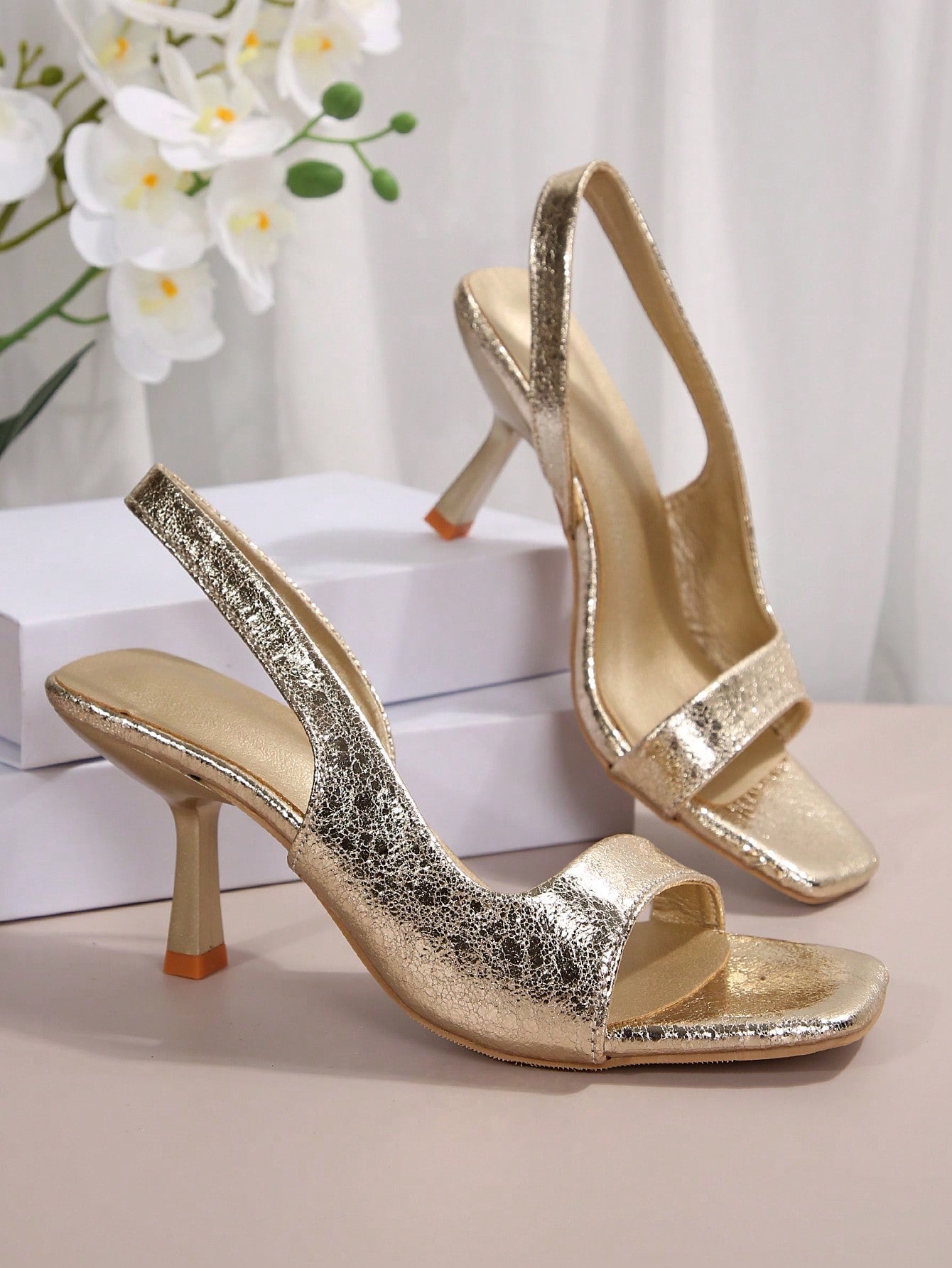 Step into summer with these show-stopping high heel sandals that prove comfort and style aren't mutually exclusive. Featuring a sleek silhouette and supportive sole, they're perfect for everything from weekend brunch to evening strolls. The elevated heel adds instant polish to any outfit while the breathable design keeps your feet happy all day long. Whether you're exploring the city or heading to an outdoor gathering, these versatile sandals deliver that effortless chic vibe you've been craving. Dress them