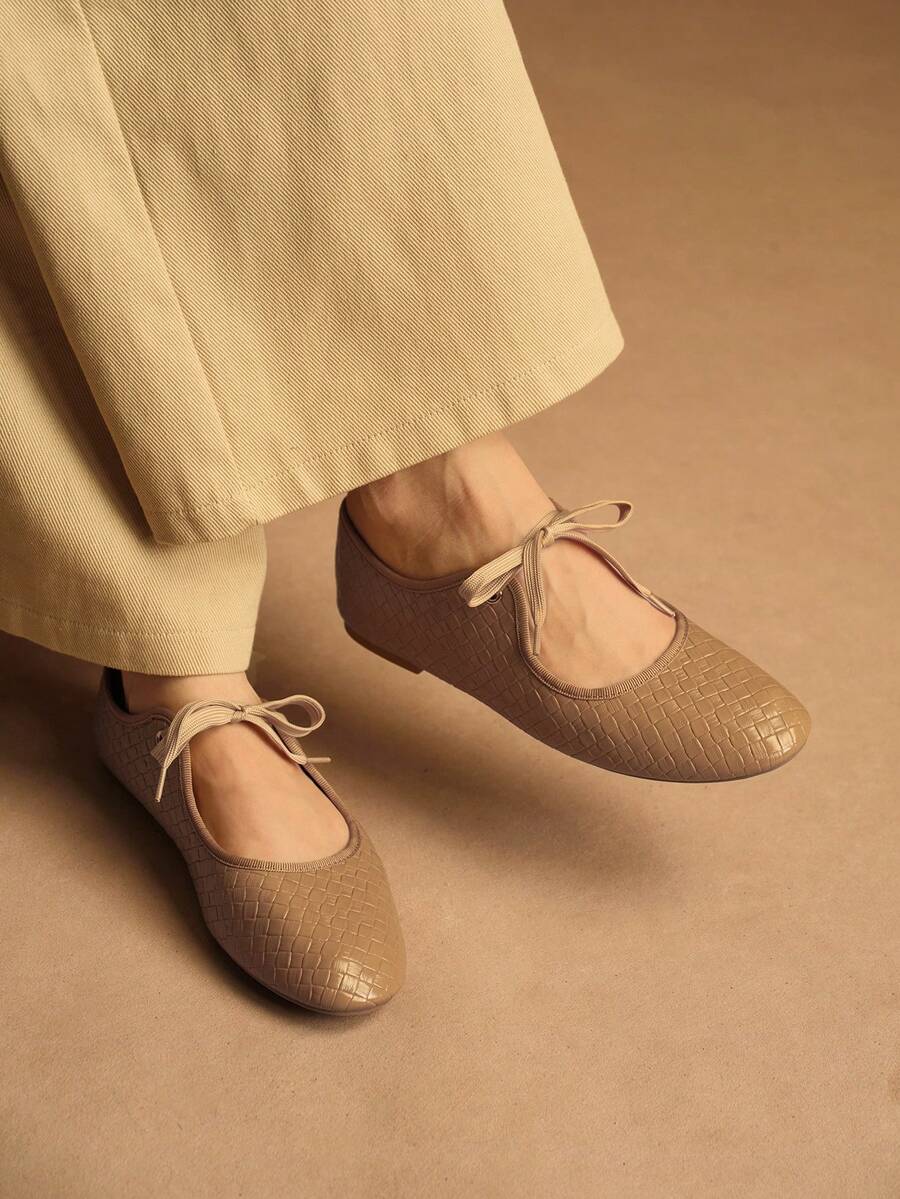 Step into effortless elegance with these versatile lace-up flat shoes designed for the modern woman. Featuring a charming bow detail and animal print pattern, they seamlessly transition from office to outdoor settings. Crafted with premium PU leather uppers and a durable TPR outsole, these Mary Jane-style flats deliver all-day comfort without compromising on style. The fabric lining and PU leather insole provide cushioning support, while the camel tone complements any casual or business casual wardrobe. Per