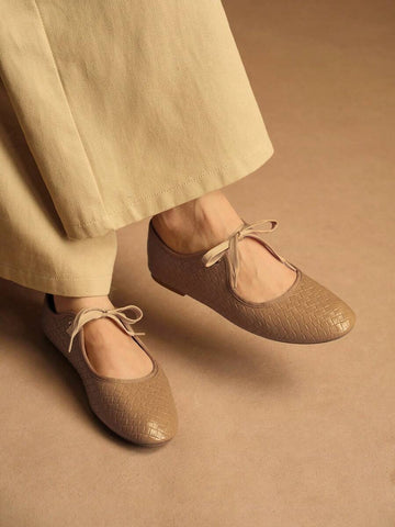 Step into effortless elegance with these versatile lace-up flat shoes designed for the modern woman. Featuring a charming bow detail and animal print pattern, they seamlessly transition from office to outdoor settings. Crafted with premium PU leather uppers and a durable TPR outsole, these Mary Jane-style flats deliver all-day comfort without compromising on style. The fabric lining and PU leather insole provide cushioning support, while the camel tone complements any casual or business casual wardrobe. Per