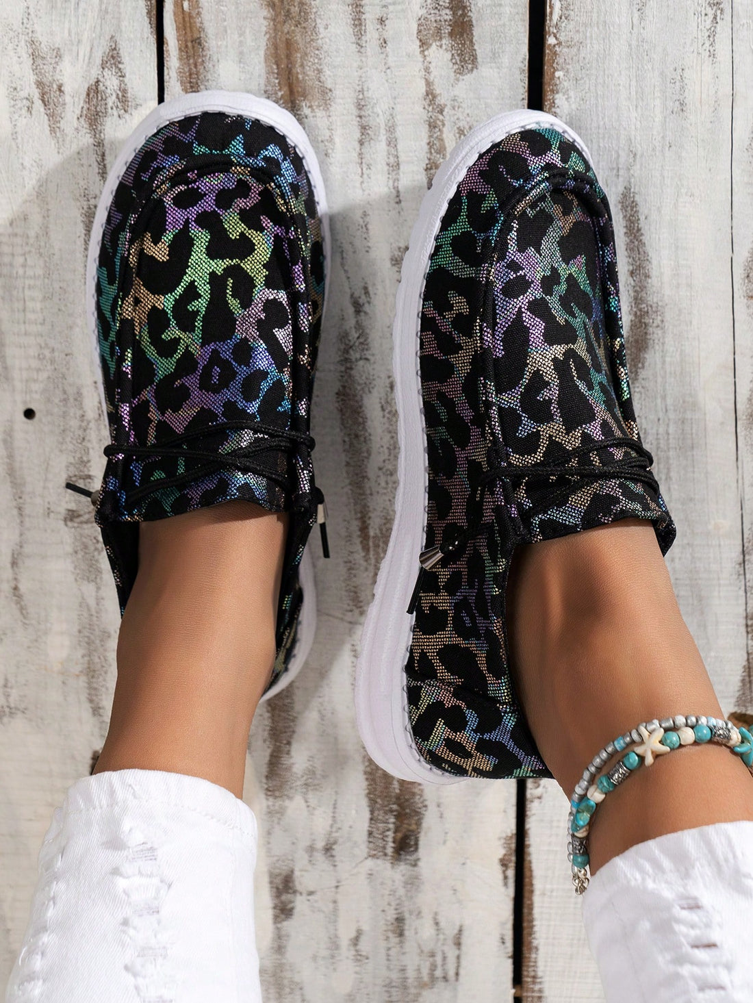 Experience effortless style and comfort with our trendy Leopard Print Slip-On Sneakers. The breathable design keeps your feet cool while the slip-resistant sole provides ultimate stability. Make a statement with the stylish leopard print pattern, perfect for any casual or active occasion.