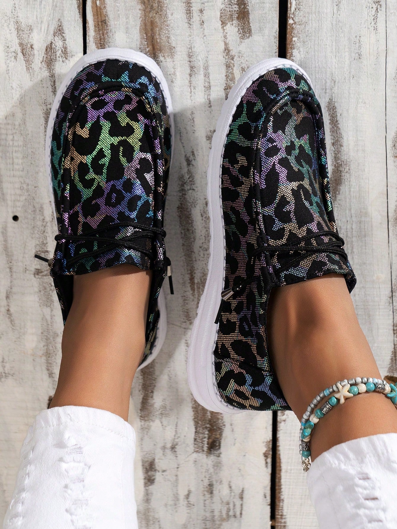 Experience effortless style and comfort with our trendy Leopard Print Slip-On Sneakers. The breathable design keeps your feet cool while the slip-resistant sole provides ultimate stability. Make a statement with the stylish leopard print pattern, perfect for any casual or active occasion.