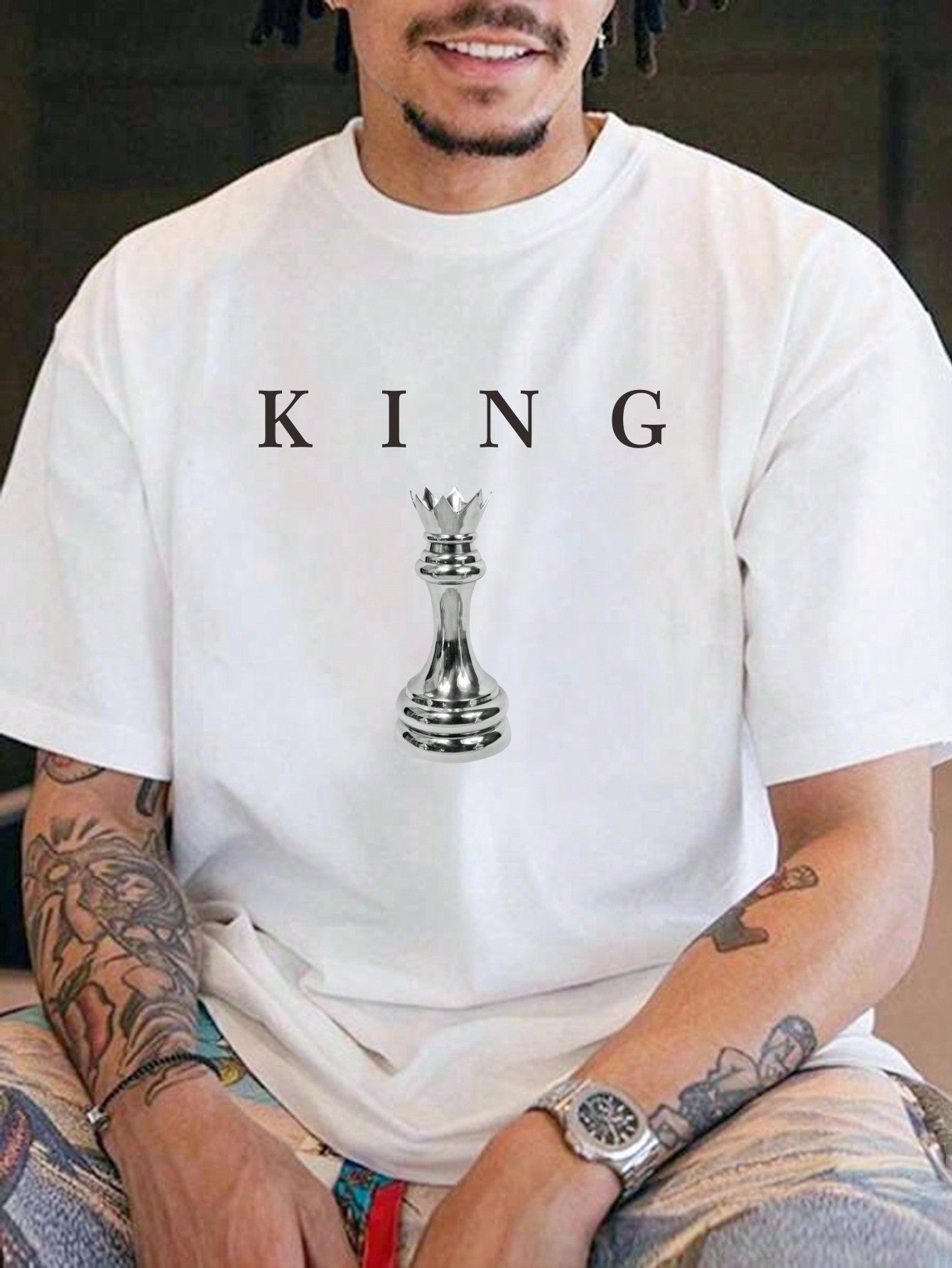 Be the king of your style game with our Trendy Men's Casual Chess Print T-Shirt! This round neck, short sleeve tee features a unique chess print that will surely make a statement. Stay comfortable and stylish on or off the board. Checkmate!