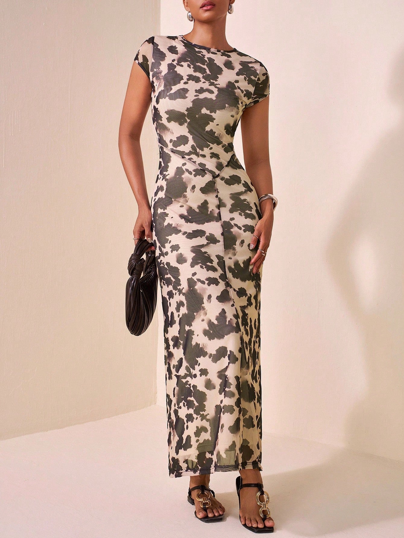 Step into fun with this Trendy Mesh Sheer Brown Polka Dot Cow Print Long Dress! Perfect for summer festivals or casual outings, its breezy mesh fabric keeps you cool while the playful cow print and polka dots turn heads. The long, flowing design adds effortless charm and lets you embrace every sunny moment in style.