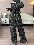 Make a statement with this effortless two-piece set that's perfect for turning heads. The off-shoulder cropped top flaunts a flirty silhouette that pairs beautifully with high-waisted wide-leg pants for a balanced, fashion-forward look. Whether you're hitting the town or keeping it casual, this combo delivers instant style without the fuss. Comfortable, versatile, and undeniably chic—your new go-to outfit awaits.
