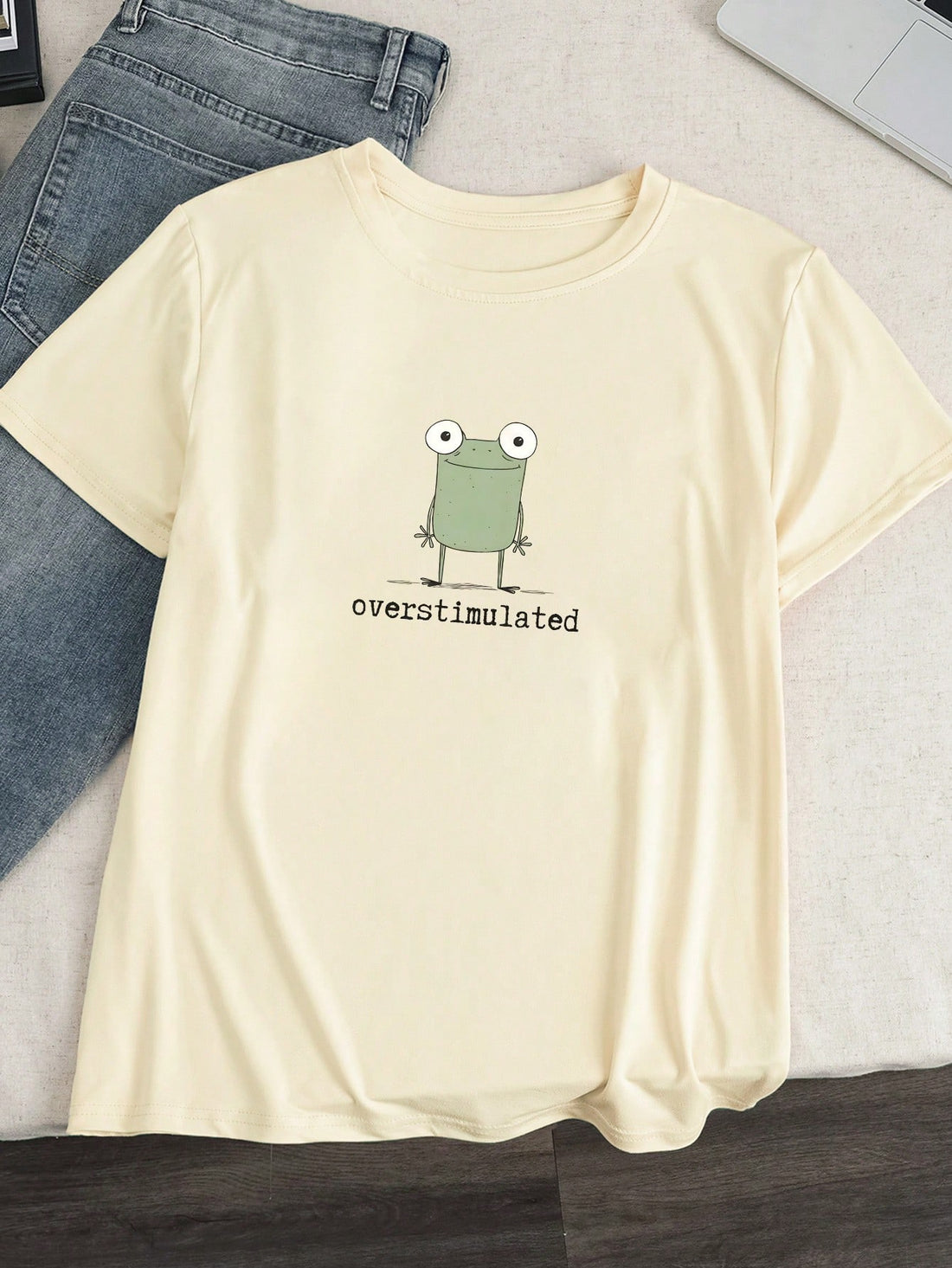 Express your quirky side with our Overstimulated Weird Frog Graphic Tee! This women's t-shirt features a hilariously chaotic frog design that perfectly captures that "too much coffee" energy we all know and love. Made for the bold fashionista who isn't afraid to stand out, this conversation-starting tee pairs perfectly with jeans, skirts, or under a casual blazer. Hop into your new favorite wardrobe staple!