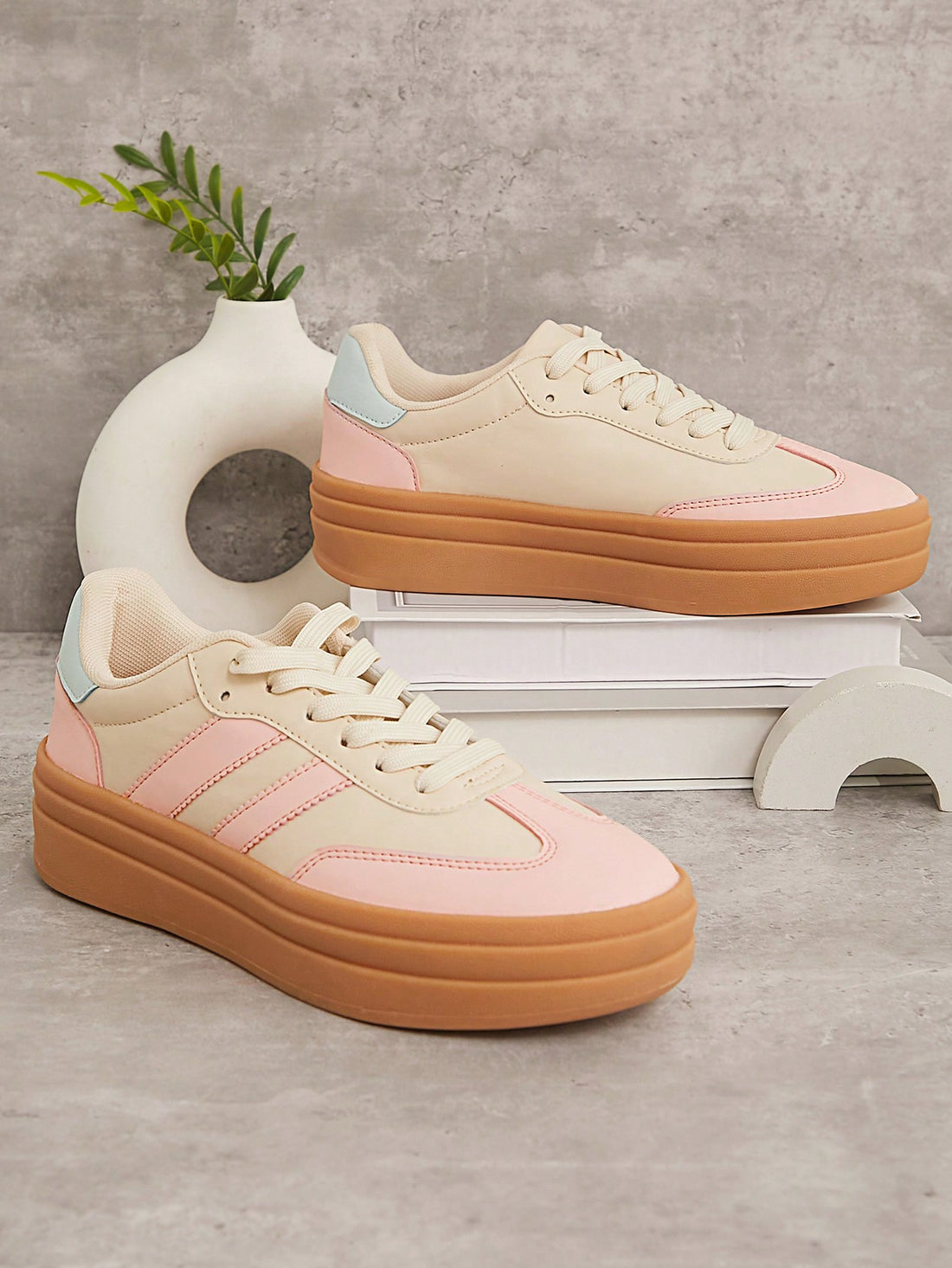 Step up your streetwear game with these trendy Pink & Yellow Striped Flatform Sneakers! The bold design is perfect for making a statement this Fall and Winter. Stay stylish and comfortable in these eye-catching kicks.