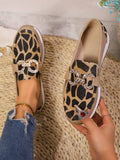Step into effortless style with these eye-catching plus size wedge loafers. Featuring a bold leopard print design accented with a sleek metal chain detail, these shoes deliver personality and comfort in one package. The cushioned wedge sole provides all-day wearability, whether you're running errands around town or exploring new destinations. The roomy fit accommodates wider feet while the elevated heel adds a flattering lift to any casual outfit. Perfect for pairing with jeans, dresses, or weekend wear