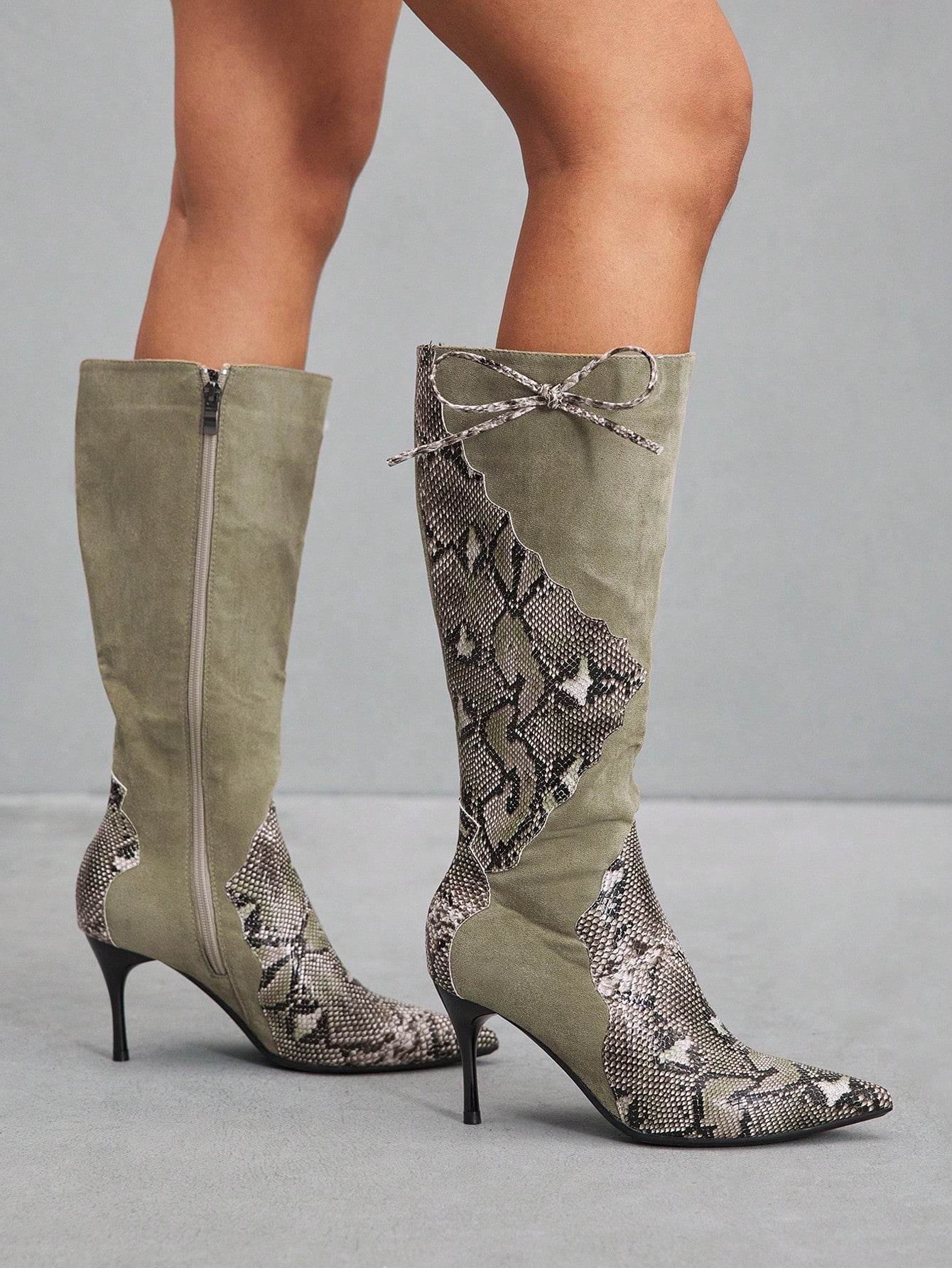 Step into the spotlight with these show-stopping thigh-high boots that scream sophistication and sass. Featuring a sharp pointed toe and a commanding high heel, these boots are your ticket to turning heads wherever you go. Perfect for elevating any outfit—from edgy night-out looks to polished everyday ensembles—they deliver that coveted fashion-forward edge. Slip them on and feel the confidence surge. Because great style isn't just about what you wear; it's about how you wear it.