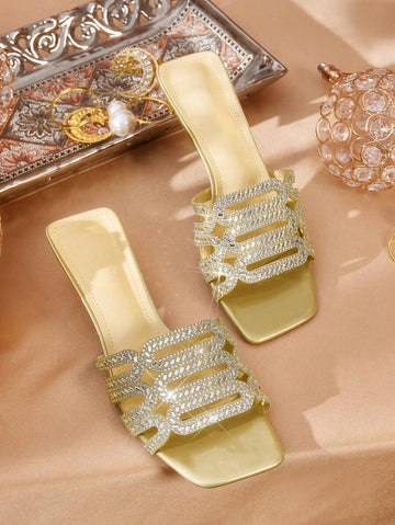 Step into sparkle with these Trendy Rhinestone-Embellished Square Toe Silver Slide Sandals for Women. Perfect for adding a dash of glam to any outfit, their eye-catching rhinestones catch the light—and compliments! The chic square toe design keeps your look fresh and fashionable, while the easy slide-on style makes slipping into summer fun effortless. Whether you're headed to brunch or a night out, these sandals bring playful shine to every step.