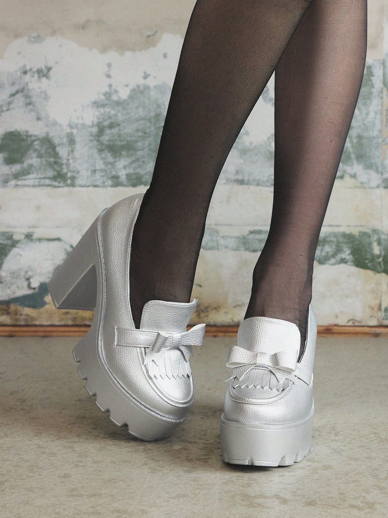 Step out in style with these Trendy Silver High Heel Slip-On Loafers! Featuring chunky heels and playful fringe details, these Mary Jane Oxfords add a fun twist to any outfit. Easy to slip on and designed for comfort, they’re perfect for turning heads wherever you go. Shine bright and dance through your day with a touch of silver sparkle!