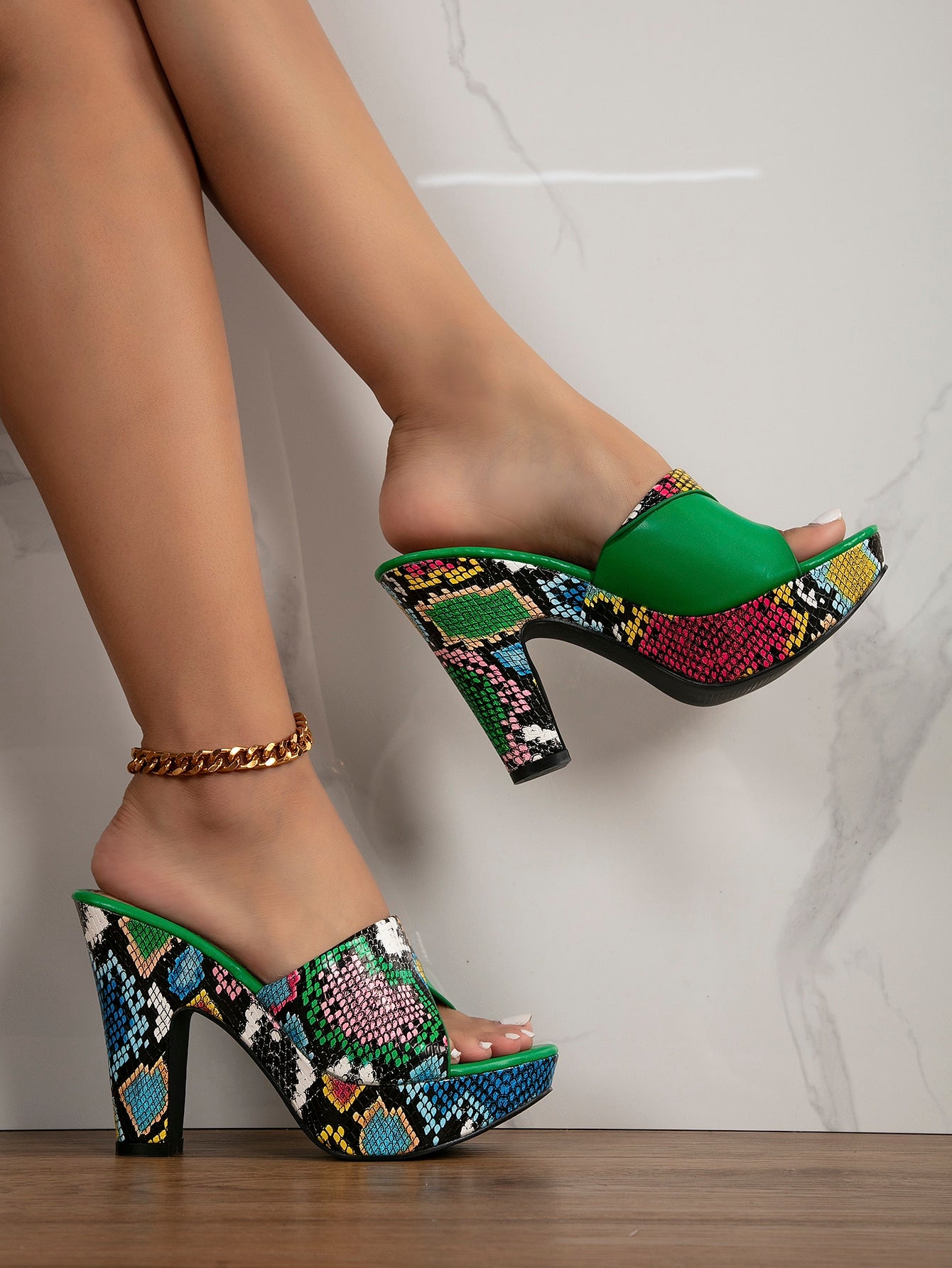 Elevate your style with our Trendy Snakeskin Embossed Chunky Heeled Mule Sandals. With a chic snakeskin texture and bold chunky heel, these sandals add a stylish touch to any outfit. The platform design provides extra height and comfort, making them perfect for any fashion-forward statement.