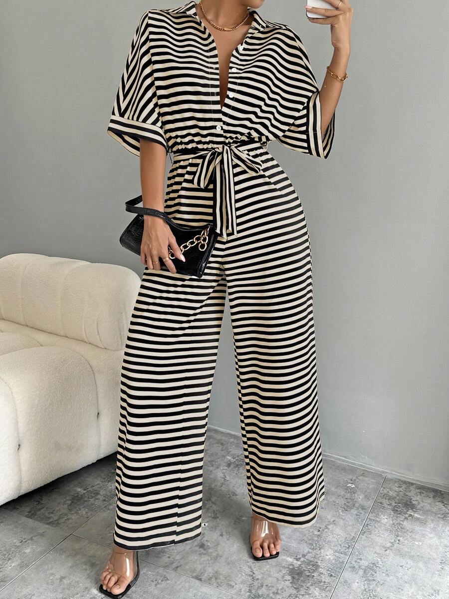 Front view of striped belted wide-leg jumpsuit showing visible color, print, and silhouette