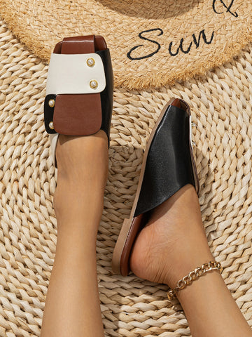 Slip on these chic sandals for a trendy two-tone look that will elevate your summer style! Made with faux pearls, these slides will add a touch of sophistication to any outfit. Perfect for strolling on the beach or exploring the city with a fun and playful attitude.