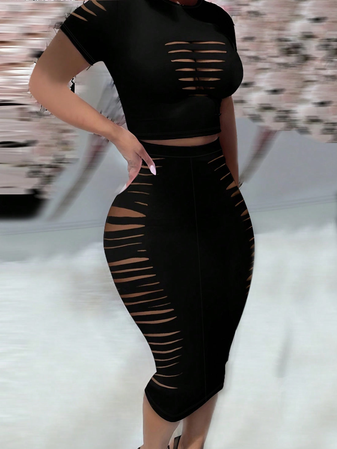 Make a statement with this playful 2-piece set that's equal parts bold and flirty. The cropped top features an eye-catching hollow-out design that adds edge, while the adjustable drawstring lets you customize the fit to perfection. Pair it with the matching mini skirt for an instant outfit that turns heads. Whether you're hitting the town or making a casual statement, this set delivers trendy vibes and confidence in one package.