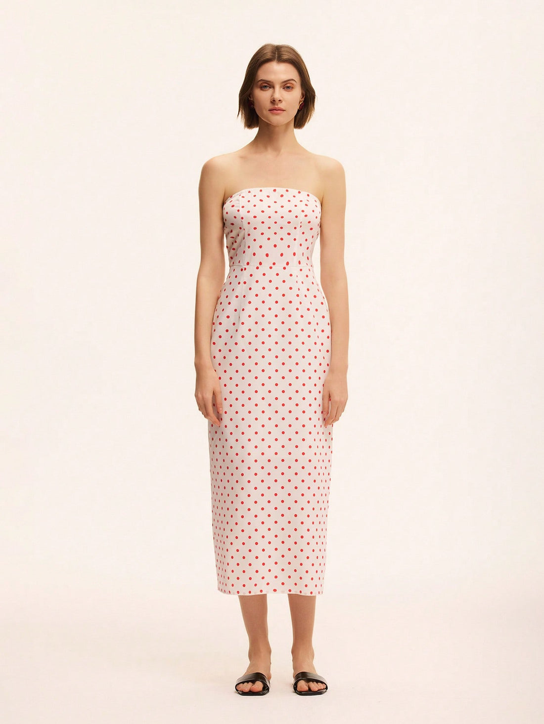 Step into summer with this playful bandeau mini dress, inspired by chic French resort style. Featuring a flirty polka dot print, its strapless design highlights your shoulders while the mini length adds a fun, youthful vibe. Perfect for sunny days and lively nights, this dress brings effortless charm and a touch of whimsy to your wardrobe.