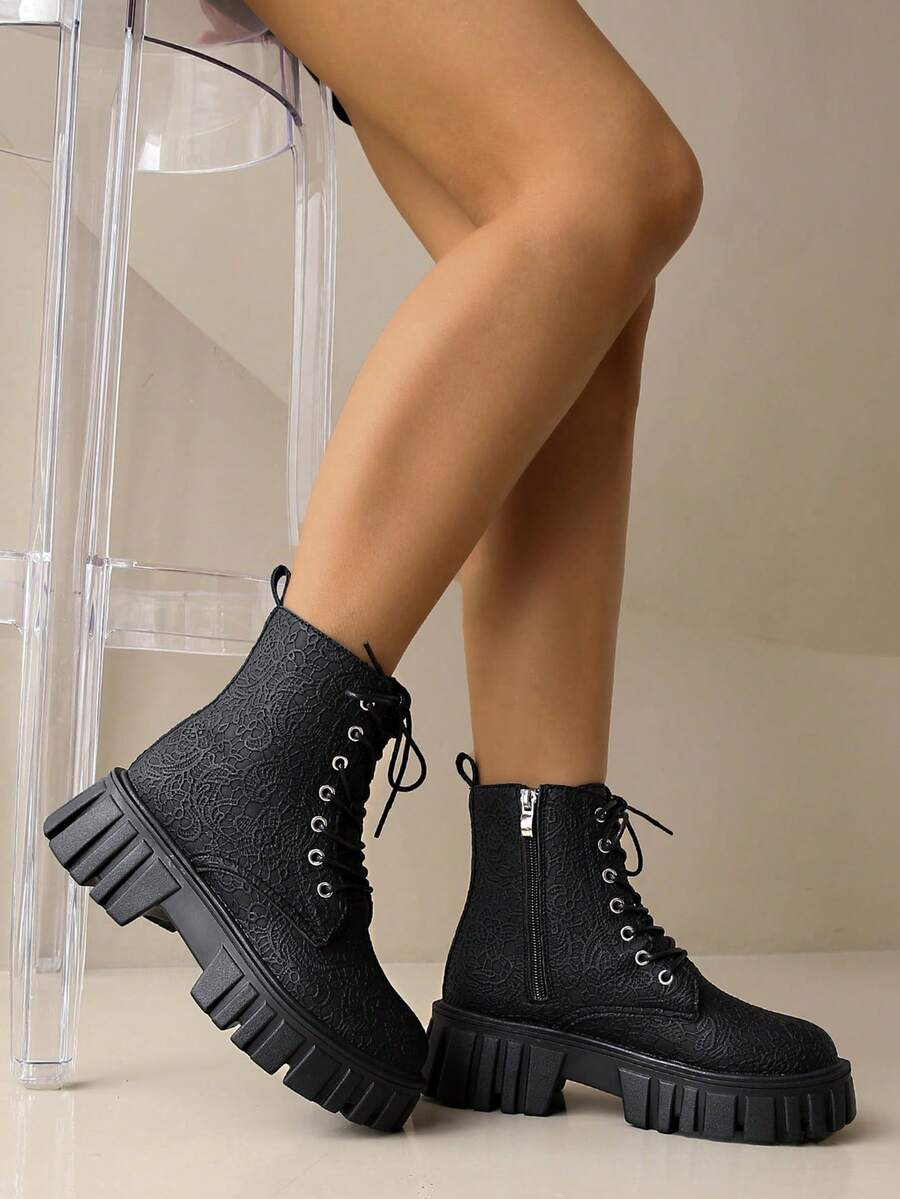 Rev up your fall and winter wardrobe with these bold motorcycle boots that blend edgy attitude with undeniable style. The striking black and white colorway turns heads while the chunky sole delivers serious comfort for all-day wear. Whether you're channeling rebel vibes or just want footwear with personality, these boots are your go-to for making a statement. Built tough, styled sharp—the perfect pair for anyone who refuses to blend in.