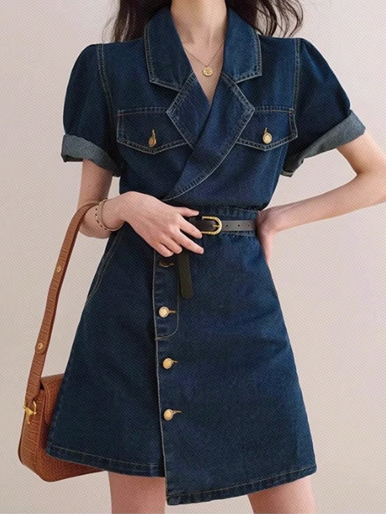 Get ready to rock the streets with our Trendy Women's Casual Denim Dress! With front buttons and an unexpected asymmetric hem, this dress is both stylish and playful. Perfect for any casual outing, this dress will have all eyes on you. No wonder it's a must-have for fashion-forward women!