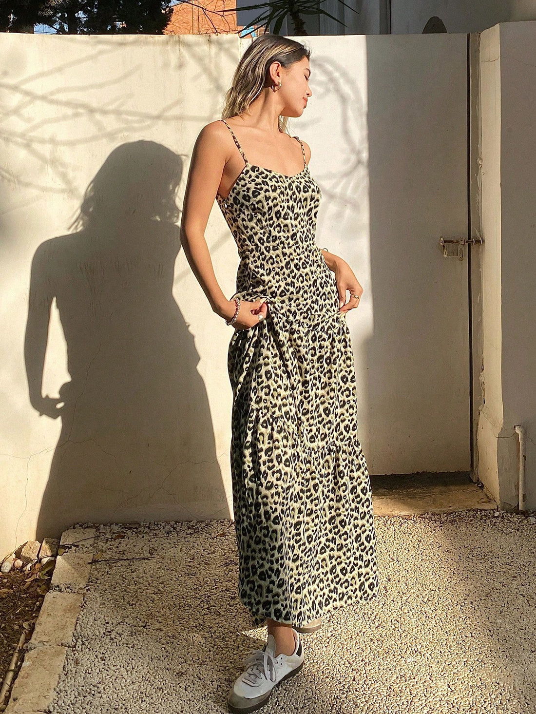 Make a statement in our eye-catching Leopard Print Cami Dress! This sassy number features a flattering sleeveless cut and flirty ruffled hem that adds just the right amount of bounce to your step. Perfect for summer brunches, beach days, or dancing the night away. The wild pattern turns heads while the breezy silhouette keeps you cool when temperatures rise. Unleash your fierce fashion sense!