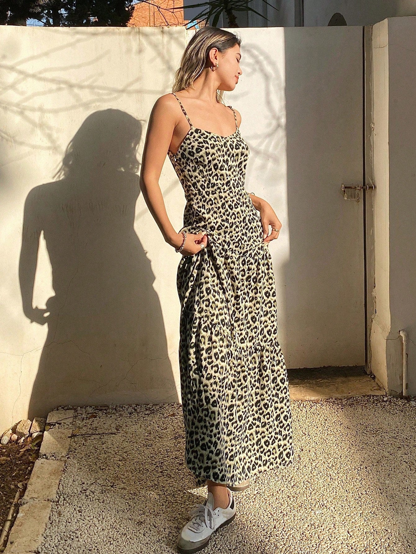 Make a statement in our eye-catching Leopard Print Cami Dress! This sassy number features a flattering sleeveless cut and flirty ruffled hem that adds just the right amount of bounce to your step. Perfect for summer brunches, beach days, or dancing the night away. The wild pattern turns heads while the breezy silhouette keeps you cool when temperatures rise. Unleash your fierce fashion sense!