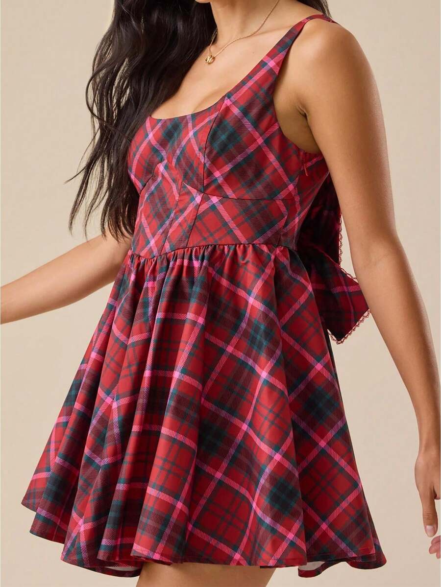 Elevate your seasonal wardrobe with this charming mini plaid dress. Featuring delicate spaghetti straps and a sleeveless silhouette, it's perfect for warm weather styling. The A-line cut flatters your figure while the pleated hem adds playful movement. Crafted from lightweight, breathable 100% polyester with high stretch fabric, this dress moves with you throughout your day. The bow back detail and natural waistline create an effortlessly cute look ideal for casual outings, dates, or everyday wear. Comforta