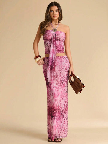 Make a bold statement with this eye-catching two-piece set featuring a vibrant pink leopard print. The halter neck camisole offers a flattering, adjustable fit with a modern edge, while the coordinating skirt provides effortless style. Perfect for nights out, casual gatherings, or anyone looking to add a trendy pop of personality to their wardrobe. The matching set takes the guesswork out of styling—slip it on and go. Comfortable, confident, and undeniably chic.