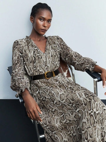 Step out in style with this trendy midi dress featuring a wild snake skin print, playful ruffle sleeves, and a chic keyhole twist collar. Perfect for turning heads at brunch or date night, its flattering silhouette combines comfort with bold fashion flair. Embrace your daring side while keeping things effortlessly fun and feminine.