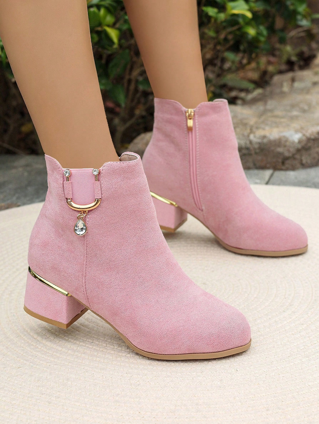 Step into the season with these stunning suede ankle boots that blend comfort with glamorous style. Featuring a eye-catching rhinestone buckle detail, they're the perfect statement piece for elevating your autumn and winter wardrobe. The soft suede construction keeps your feet cozy while the sleek silhouette works with everything from jeans to dresses. Whether you're heading to brunch or a night out, these boots deliver that effortless chic vibe that turns heads. Your feet will thank you for the cushioned c