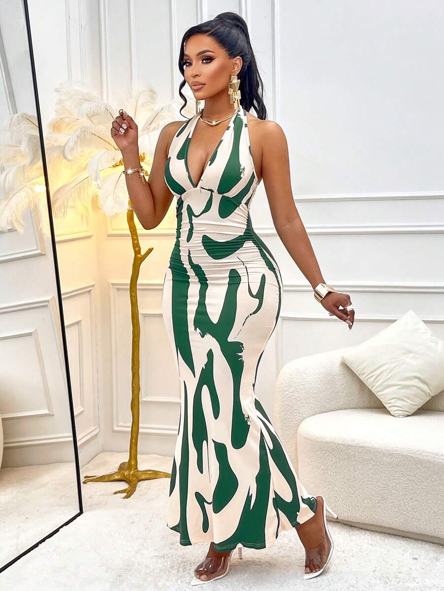 Dive into summer style with this eye-catching halterneck dress that's practically made for vacation mode. The flattering pleated waist cinches you in just right, while the charming wave pattern adds a playful coastal vibe to every outfit. Perfect for beach days, resort dinners, or anywhere you want to turn heads. Slip it on and feel the confidence—this dress does all the heavy lifting so you can focus on making memories.