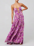 Front view of purple floral spaghetti-strap maxi dress with ring cutouts and tiered skirt
