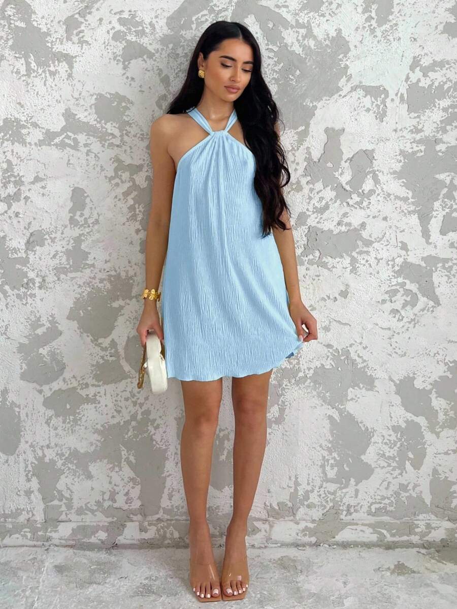 Brighten your summer with this trendy yellow halter mini dress! Its sleeveless design keeps you cool, while the playful cut makes it ideal for vacations or graduation celebrations. Lightweight and fun, it’s your go-to for sunny days and memorable moments.