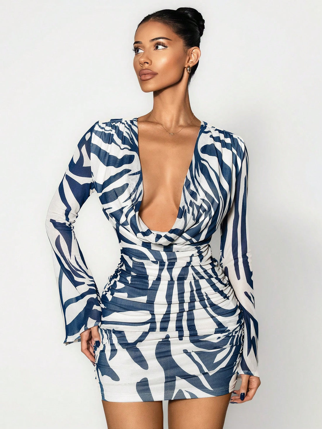 Make a statement this fall with our eye-catching zebra print pleated dress! The dramatic trumpet sleeves and chic swing collar create an instantly polished silhouette that turns heads. Pleated detailing adds movement and dimension, while the bold monochrome pattern brings that trendy edge to your seasonal wardrobe. Perfect for elevating your everyday style or standing out at special occasions. Embrace your fashion-forward side and own the room in this show-stopping piece!