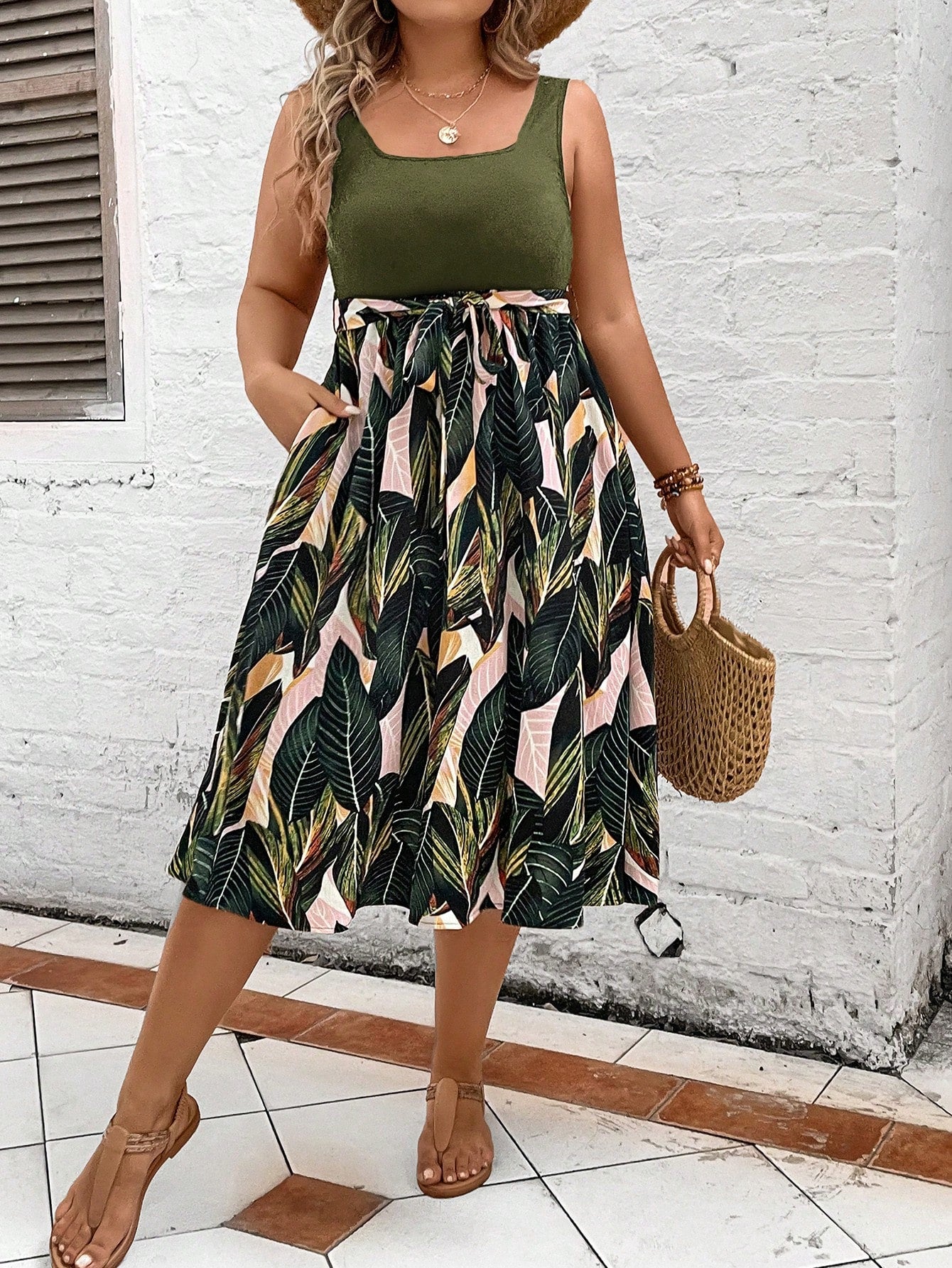 Escape to paradise in our Tropical Escape plus-size belted dress! With a vibrant print that will make you stand out in any crowd, this dress is perfect for any summer occasion. The belted waist adds a flattering touch, making you feel confident and stylish. Don't miss out on this must-have dress!