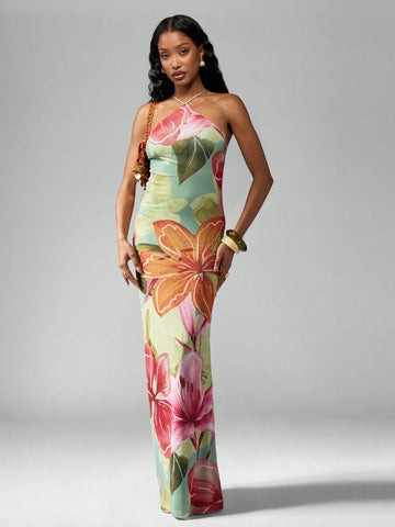 Turn heads this summer with our Tropical Floral Halter Neck Maxi Dress, perfect for sunny beach days and special occasions alike. Its vibrant floral print and flowing silhouette bring a playful, breezy vibe to your wardrobe, making every step feel like a tropical getaway. The halter neck design adds a flirty touch while keeping you cool and comfortable under the sun. Whether you're strolling along the shore or dancing into the evening, this dress is your go-to for effortless summer style and endless fun.