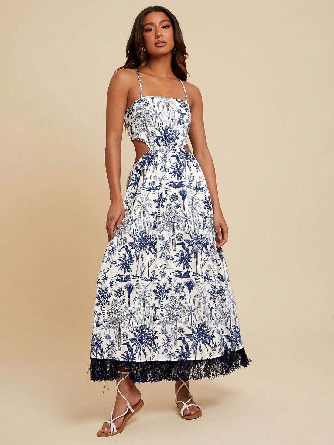 Bring sunshine wherever you go with this Tropical Floral Tasseled Spaghetti Strap Dress. Lightweight and breezy, its playful tassels and vibrant floral print make it a must-have for your summer getaway. Effortlessly stylish, it keeps you cool while turning heads on beach days or evening strolls. Ready to dance in the warm breeze? This dress is your perfect vacation companion.