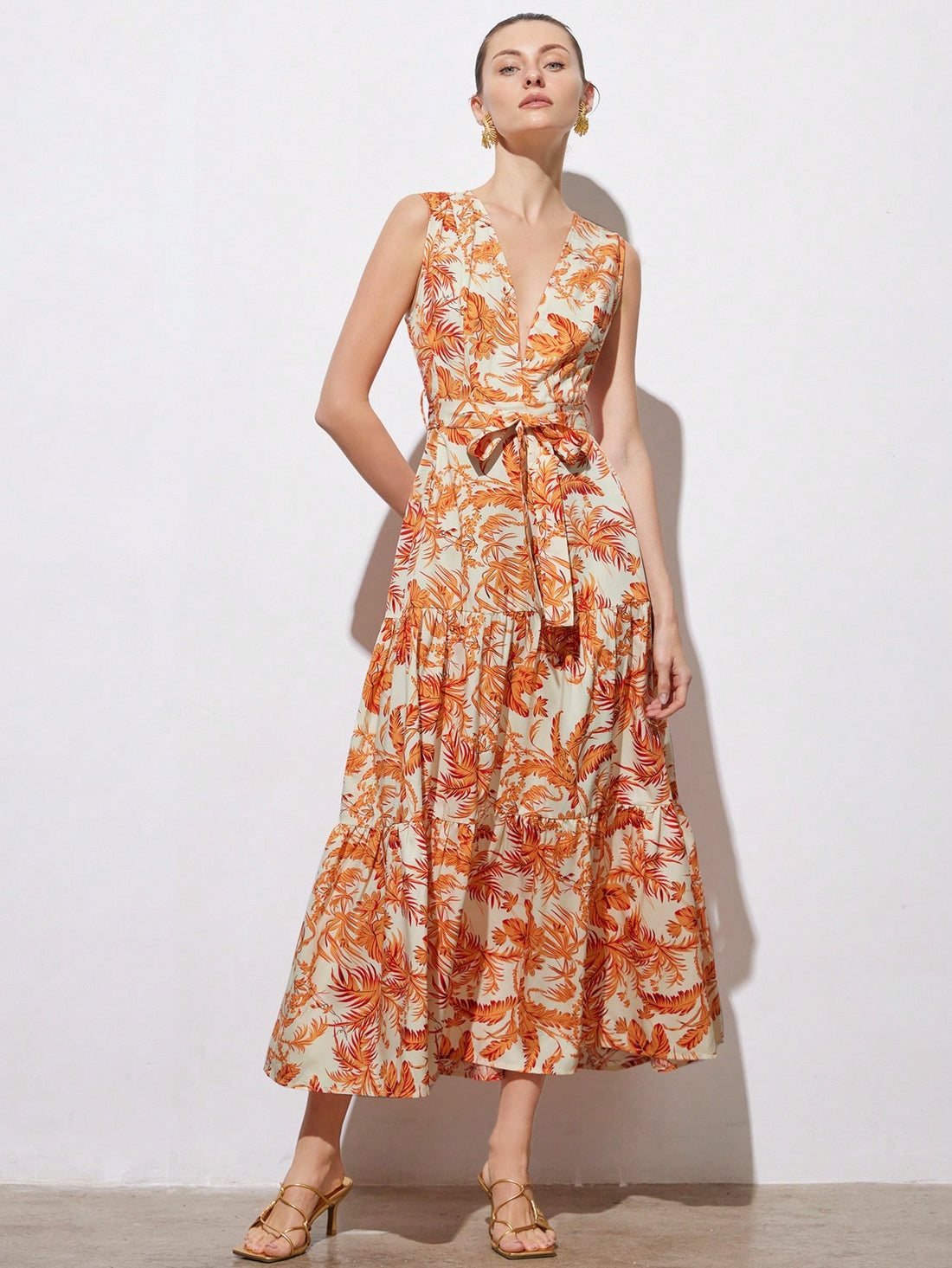 Step into sunshine with this Tropical Floral V-Neck Dress, designed to brighten your spring and summer days. Its playful floral pattern and flattering cinched waist create a fun, feminine silhouette perfect for any sunny adventure or casual outing. Lightweight and breezy, this dress keeps you cool while turning heads wherever you go. Embrace effortless elegance with a splash of tropical charm!