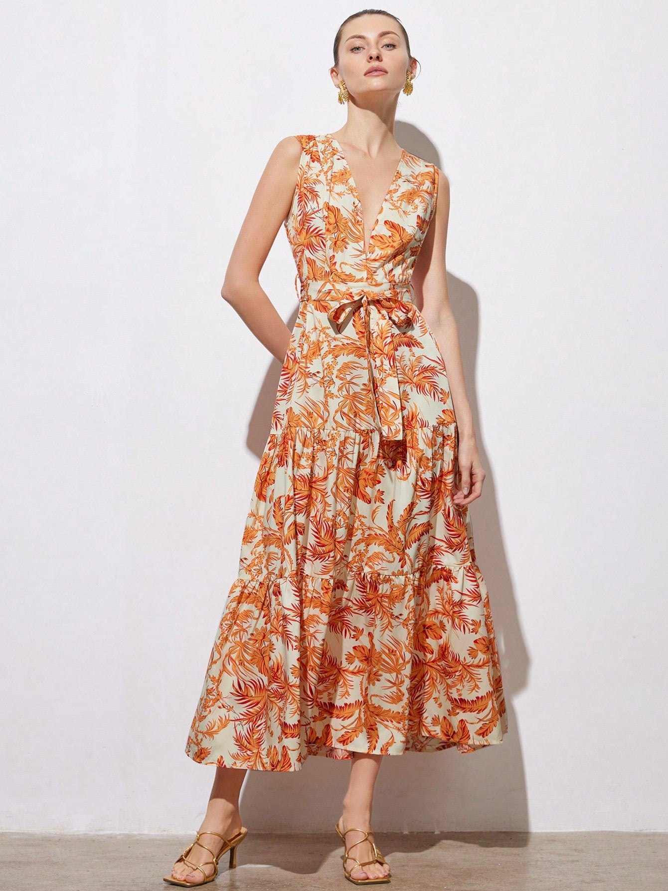Step into sunshine with this Tropical Floral V-Neck Dress, designed to brighten your spring and summer days. Its playful floral pattern and flattering cinched waist create a fun, feminine silhouette perfect for any sunny adventure or casual outing. Lightweight and breezy, this dress keeps you cool while turning heads wherever you go. Embrace effortless elegance with a splash of tropical charm!